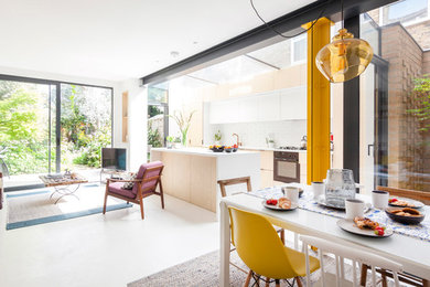 Trendy dining room photo in London