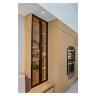 Tall Glass Cabinet Framing the Kitchen Entry - Transitional - Kitchen