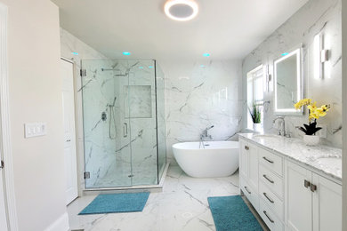 Large minimalist master white tile and porcelain tile porcelain tile, white floor and double-sink bathroom photo in Chicago with shaker cabinets, white cabinets, a one-piece toilet, white walls, an undermount sink, marble countertops, a hinged shower door, white countertops, a niche and a freestanding vanity
