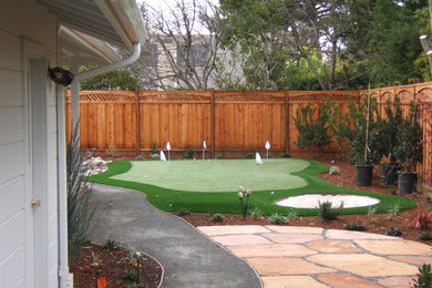 Inspiration for a large traditional backyard xeriscape in San Francisco with concrete pavers.