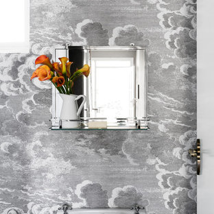 This is an example of a small eclectic powder room in Melbourne with black and white tile and multi-coloured walls.