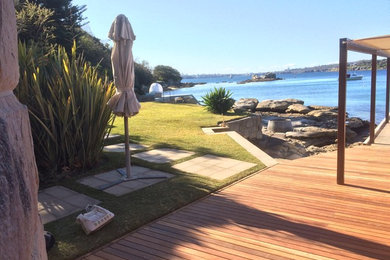 This is an example of a beach style deck in Sydney.
