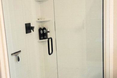 Bathroom photo in Phoenix with a hinged shower door