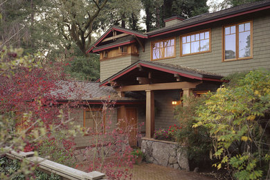 Photo of a traditional two-storey green exterior in San Francisco with mixed siding.