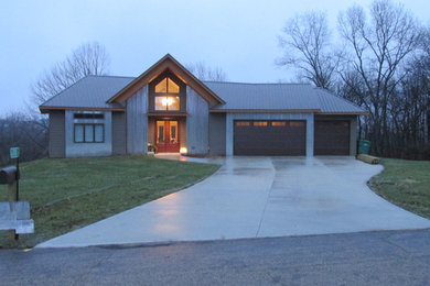Mid-sized contemporary exterior home idea in Other