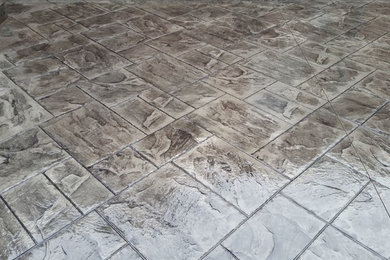 Inspiration for a mid-sized timeless backyard stamped concrete patio remodel in St Louis