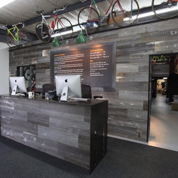 Reclaimed barn wood accent wall for commercial bike shop. - Products