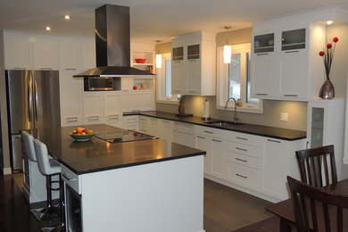 Inspiration for a mid-sized transitional porcelain tile and gray floor eat-in kitchen remodel in Other with an undermount sink, shaker cabinets, white cabinets, granite countertops, stainless steel appliances and an island