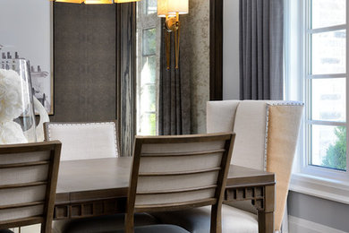 Example of a transitional dining room design in Other