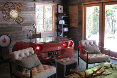 Inspiration for an eclectic concrete floor living room remodel in Los Angeles with brown walls