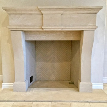 Tuscan style hand-carved stone fireplace.