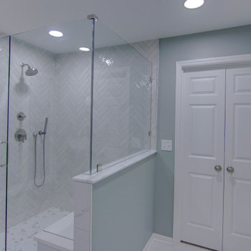 Modern Bathroom Remodel with Sleek Nickel Finishes and Hex Tile Details