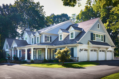 Huge contemporary gray three-story vinyl gable roof idea in Philadelphia