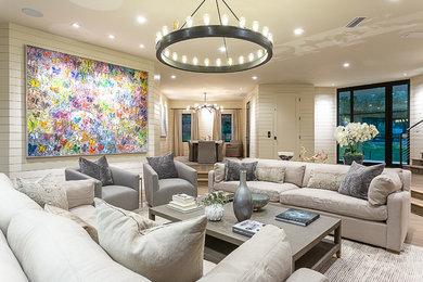 Example of a large cottage formal and enclosed medium tone wood floor and brown floor living room design in Austin with white walls, a standard fireplace, a tile fireplace and a wall-mounted tv