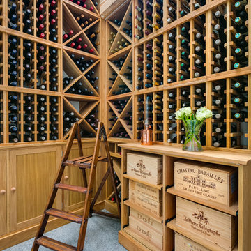 Private residential wine room in London with large glass frontage, made from oak