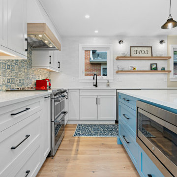 Serene Blue Oasis: Kitchen Renovation with White Perimeter and Meditation-Inspir