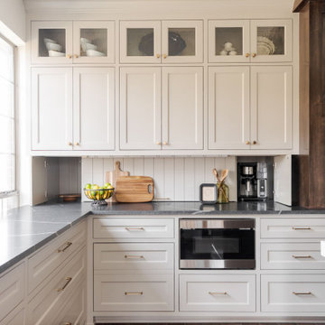 Painted Inset Cabinetry and Leathered Granite in a Transitional Edmond Kitchen