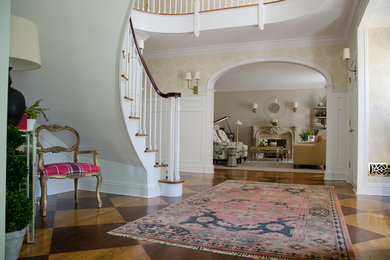 Foyer - large eclectic painted wood floor and brown floor foyer idea in Bridgeport with yellow walls
