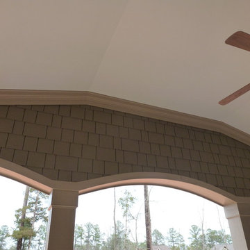 Stone, shake, arches, columns, board and batten