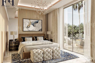 Example of a large trendy master marble floor and white floor bedroom design in Other with beige walls