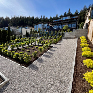 Gravel pathways with stone planter bed borders