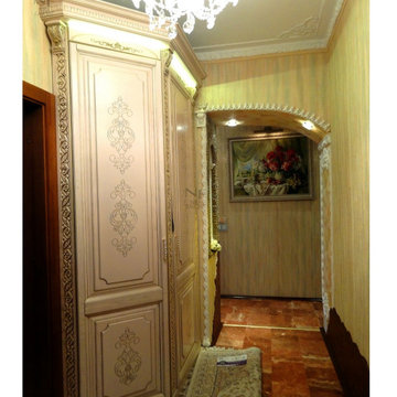 CLASSIC WOODEN WARDROBE WITH DECORS AND PATINA IN A HALLWAY / LIVING ROOM