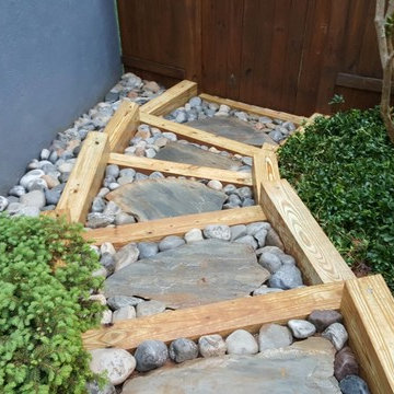 Exterior stairs with underground drainage system.