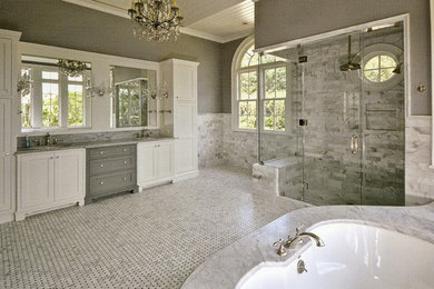 Example of a large classic master white tile and marble tile mosaic tile floor and multicolored floor alcove shower design in DC Metro with recessed-panel cabinets, white cabinets, an undermount tub, gray walls, an undermount sink, marble countertops and a hinged shower door
