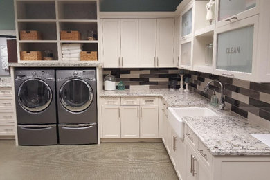 Laundry room - modern l-shaped laundry room idea in Dallas with granite countertops and white countertops