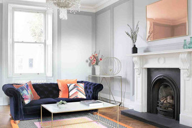 Example of an eclectic living room design in Dublin with gray walls
