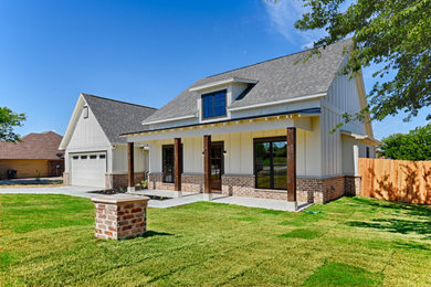 Cottage white one-story concrete fiberboard and board and batten exterior home photo in Dallas with a shingle roof