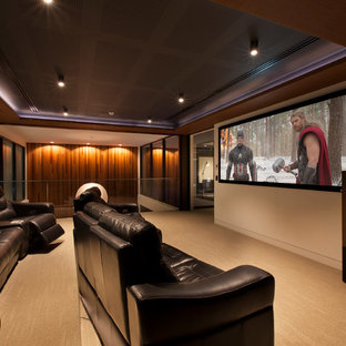 Trendy carpeted home theater photo in Melbourne with a projector screen