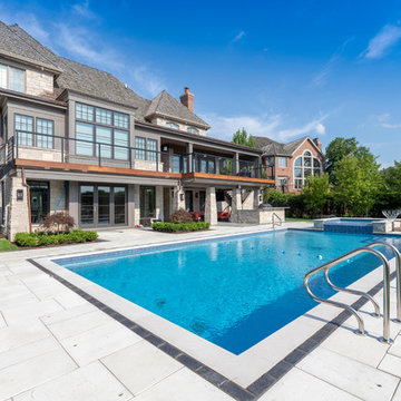Burr Ridge Lap Pool with Raised Hot Tub and Waterfall