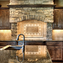 rock along the wall above the stove