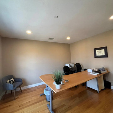 Recessed lighting gives a home office clean, glare-free light