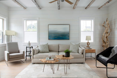 Example of a beach style living room design in Boston