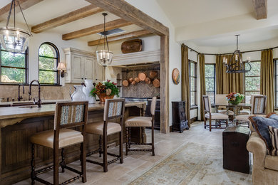 Tuscan l-shaped beige floor open concept kitchen photo in San Francisco with brown backsplash, stainless steel appliances and an island