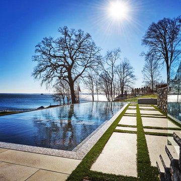 vanishing edge glass wall pool + raised perimeter overflow spa