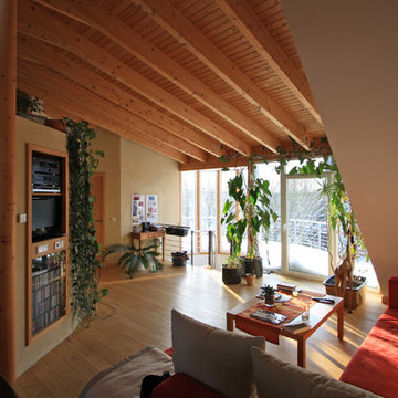 Dachgaube mit Runderker auf Reihenmittelhaus mit Holzfassade
