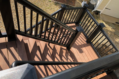 Huge backyard second story mixed material railing deck photo in New York