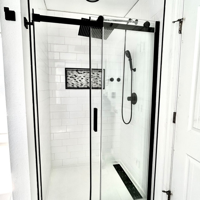 Removing the fiberglass shower kit and installing a shower pan significantly improved the amount of space in this shower. The niche allows for additional storage without taking up space in the shower.