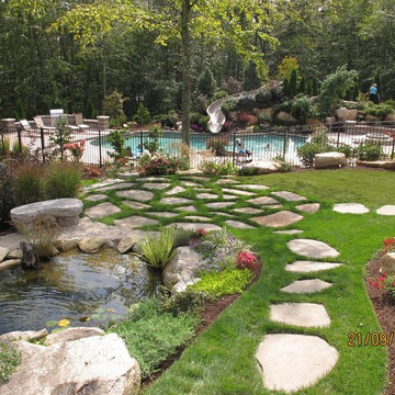 Construction process for pool with slide, water features and landscape