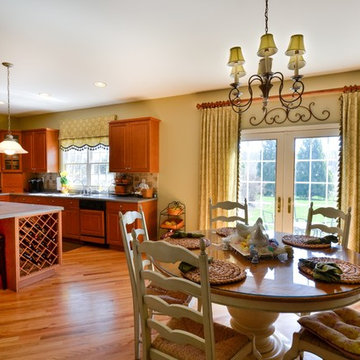 Kitchen with panels and shade with fabric and matching tassel trim.