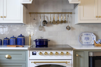 Inspiration for a small timeless u-shaped medium tone wood floor and wood ceiling enclosed kitchen remodel in Milwaukee with green cabinets