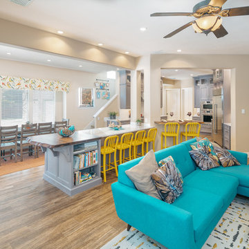 Gray Stained Walnut Cabinets and White Countertops anchor this Gourmet Kitchen