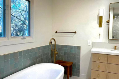 White floor and single-sink freestanding bathtub photo in Los Angeles with quartz countertops and white countertops