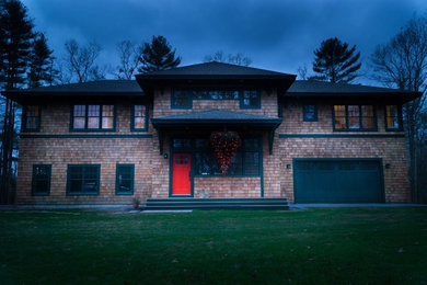 Example of a mid-sized two-story wood exterior home design in Boston with a hip roof