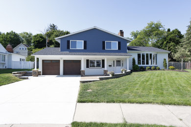 Inspiration for a modern two-story house exterior remodel in Cleveland with a shingle roof and a gray roof