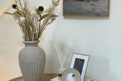 Mid-sized transitional light wood floor and brown floor entryway photo in Baltimore with white walls and a light wood front door