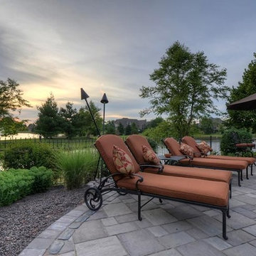 Cobblestone Landscape Renovation with Paver Pool Deck, Pergola, Outdoor Kitchen
